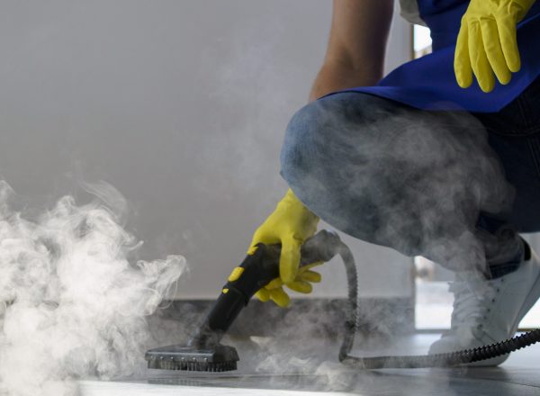 professional-cleaning-service-person-using-steam-cleaner-office-scaled (1)